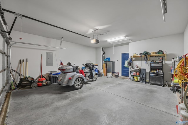 garage featuring a garage door opener and electric panel