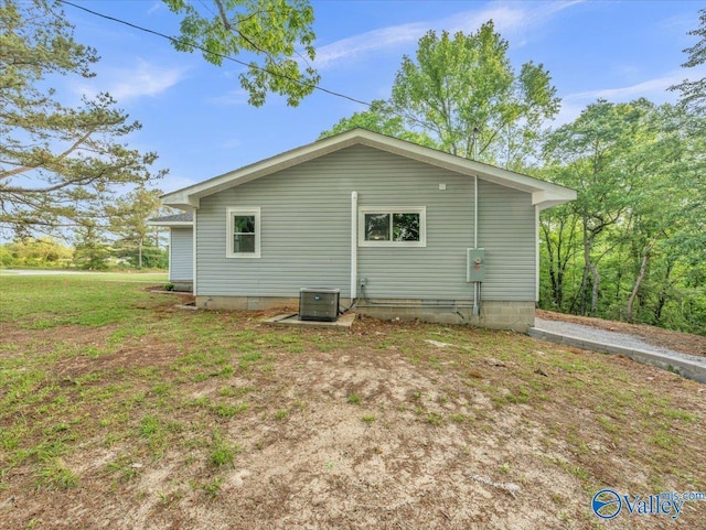view of side of property featuring cooling unit