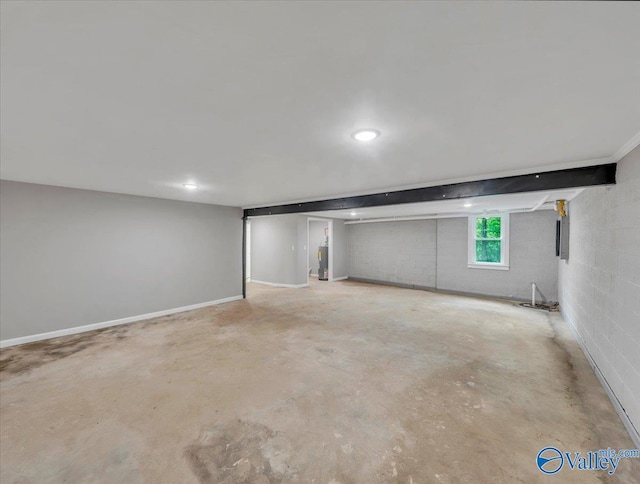 below grade area featuring recessed lighting and water heater