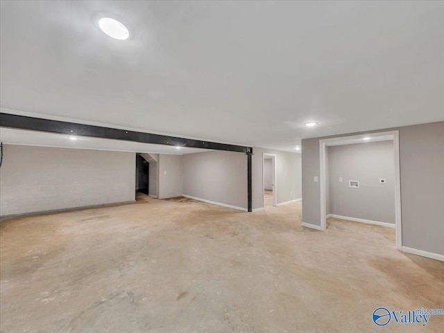 finished basement featuring baseboards