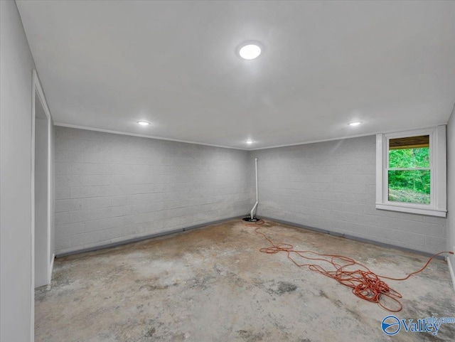 below grade area with concrete block wall and recessed lighting