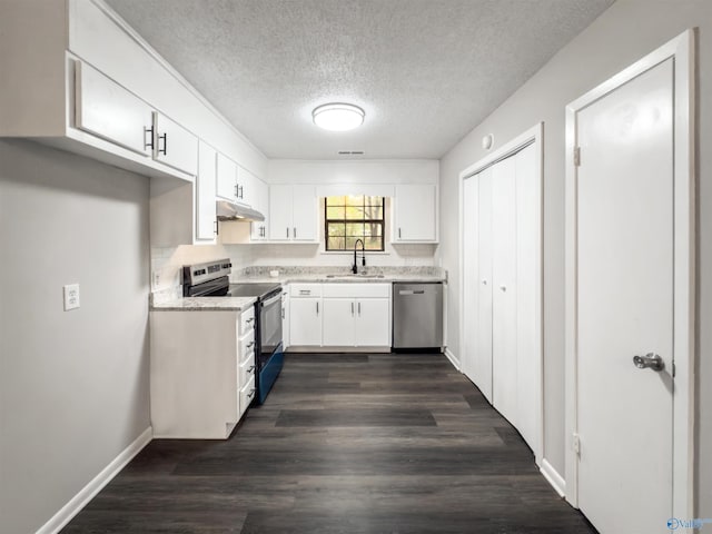 kitchen featuring white cabinetry, sink, dark hardwood / wood-style floors, a textured ceiling, and appliances with stainless steel finishes