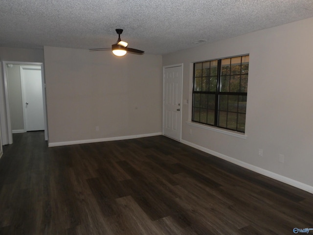 unfurnished room featuring a textured ceiling, dark hardwood / wood-style flooring, and ceiling fan