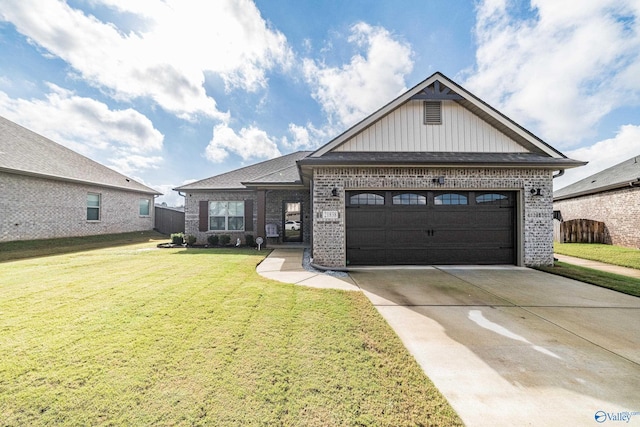 view of front of property featuring a garage and a front lawn