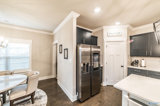 kitchen with stainless steel fridge with ice dispenser, dark hardwood / wood-style floors, crown molding, and a notable chandelier