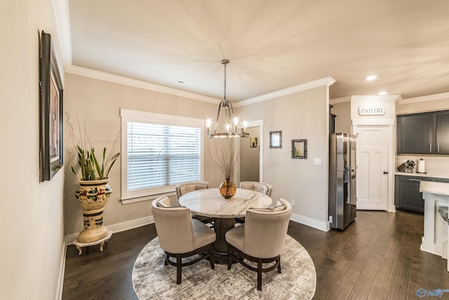 dining space with a notable chandelier, dark hardwood / wood-style floors, and crown molding