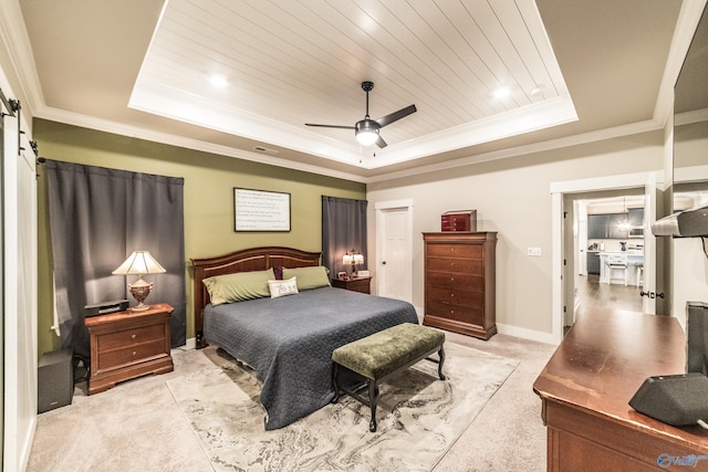 carpeted bedroom with a barn door, a raised ceiling, ceiling fan, and wooden ceiling