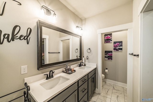 bathroom with vanity and toilet