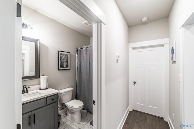 bathroom featuring a shower with curtain, vanity, toilet, and wood-type flooring