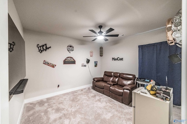 carpeted living room with ceiling fan