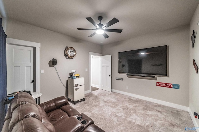 carpeted living room featuring ceiling fan