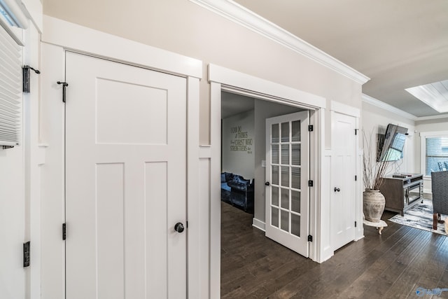 hall featuring dark hardwood / wood-style floors and ornamental molding