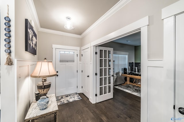 entrance foyer featuring dark hardwood / wood-style floors and ornamental molding