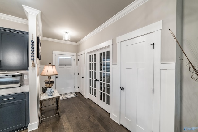 entryway with dark hardwood / wood-style floors and ornamental molding