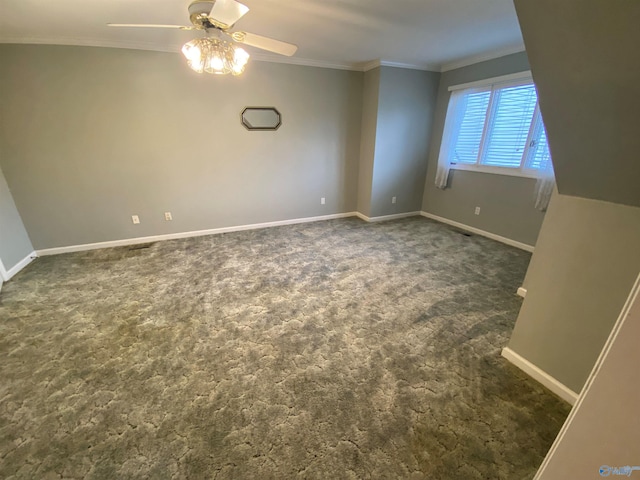 carpeted empty room with ceiling fan and ornamental molding