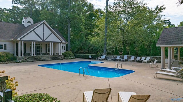 view of swimming pool featuring a patio area