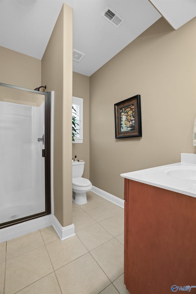 bathroom featuring walk in shower, vanity, toilet, and tile patterned floors