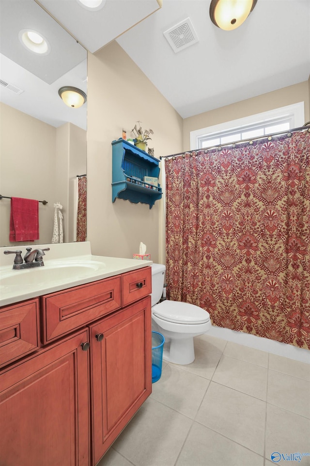 bathroom with tile patterned floors, vanity, and toilet