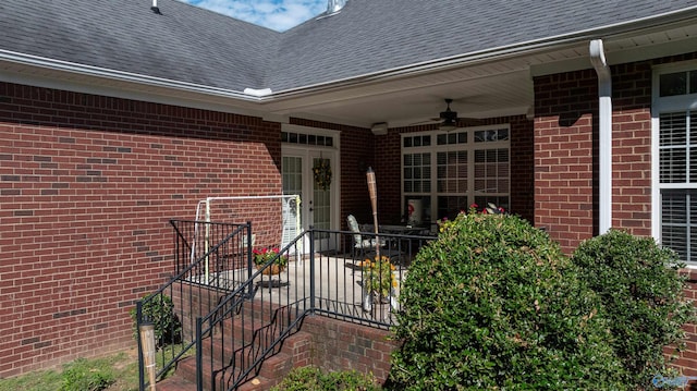 view of exterior entry featuring ceiling fan