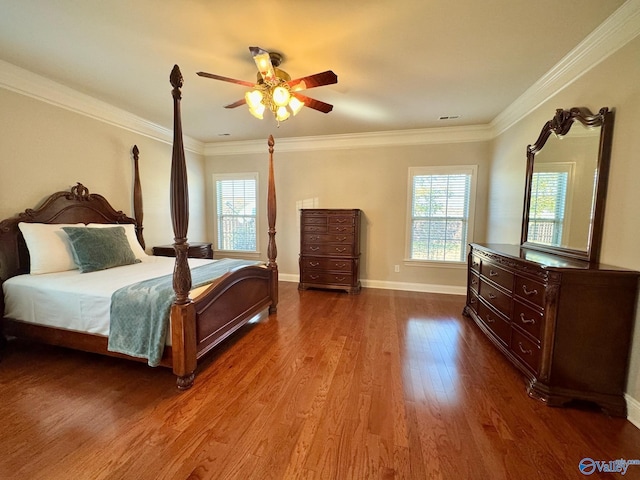 bedroom with hardwood / wood-style flooring, ceiling fan, and crown molding