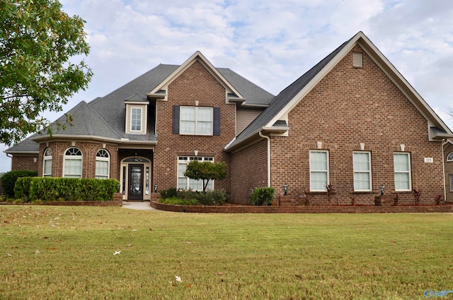 view of front facade featuring a front yard and french doors