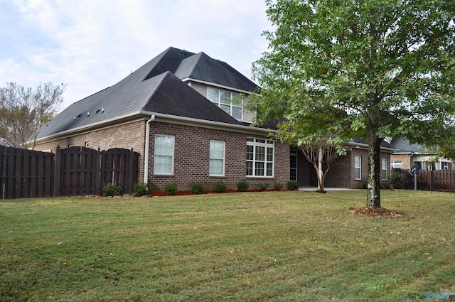 view of property exterior featuring a yard