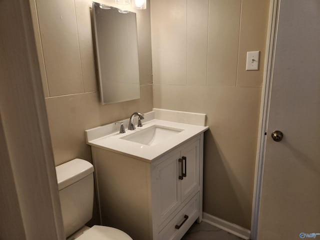 bathroom with vanity and toilet