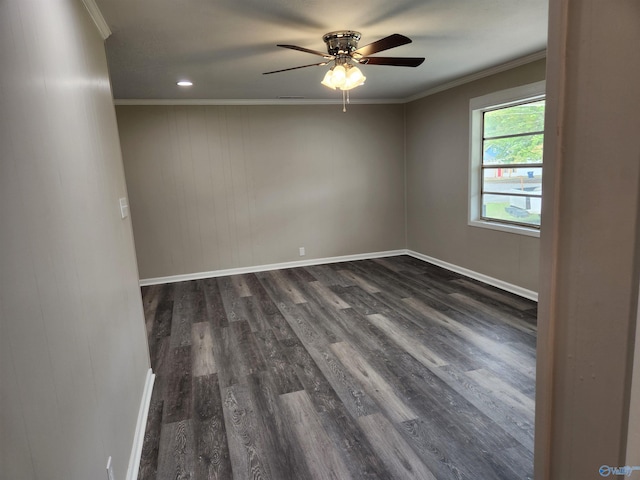 spare room with wood walls, ceiling fan, dark hardwood / wood-style floors, and crown molding