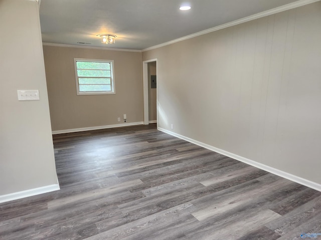 unfurnished room with dark hardwood / wood-style floors and crown molding