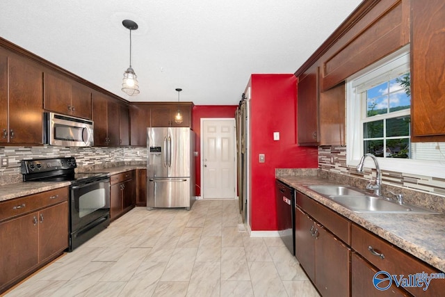 204 Hollington Dr, Huntsville, AL 35811 - kitchen with appliances with stainless steel finishes, decorative backsplash, decorative light fixtures, and dark brown cabinetry