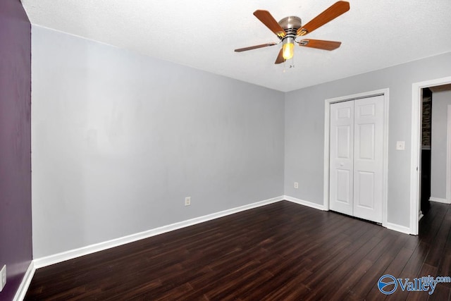204 Hollington Dr, Huntsville, AL 35811 - unfurnished bedroom with dark wood finished floors, a closet, and ceiling fan