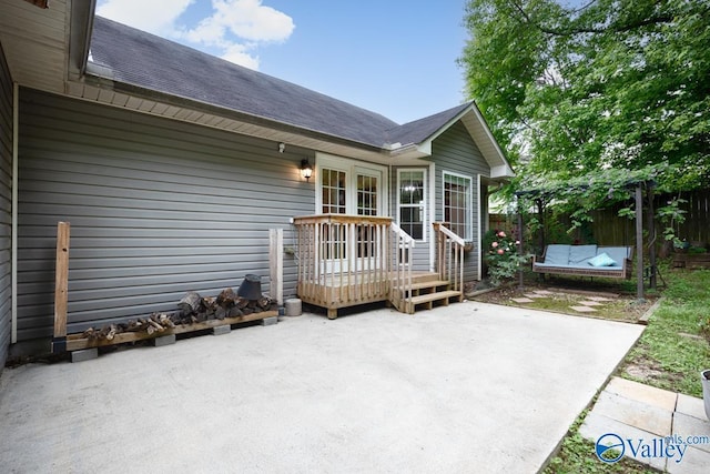 204 Hollington Dr, Huntsville, AL 35811 - rear view of house featuring a patio, a deck, and roof with shingles