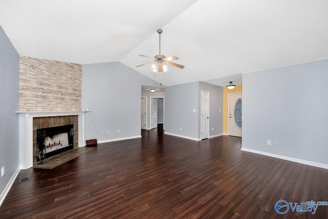 204 Hollington Dr, Huntsville, AL 35811 - unfurnished living room with a ceiling fan, a tile fireplace, wood finished floors, and lofted ceiling