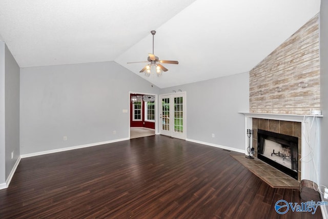 204 Hollington Dr, Huntsville, AL 35811 - unfurnished living room with ceiling fan, wood finished floors, a tiled fireplace, and high vaulted ceiling