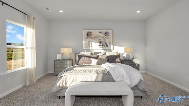 bedroom with light colored carpet