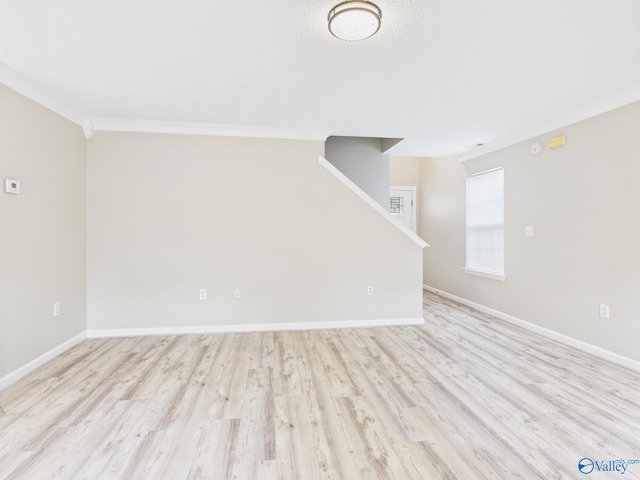 202 Declaration Cir, Madison, AL 35758 - unfurnished living room with light wood-style flooring and crown molding