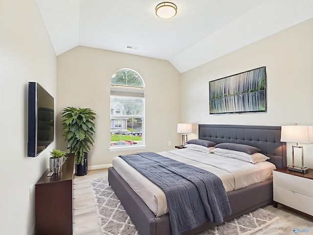 202 Declaration Cir, Madison, AL 35758 - bedroom with vaulted ceiling and light wood-type flooring