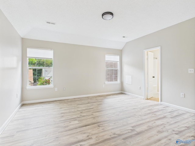 202 Declaration Cir, Madison, AL 35758 - unfurnished room with lofted ceiling, plenty of natural light, and light wood finished floors
