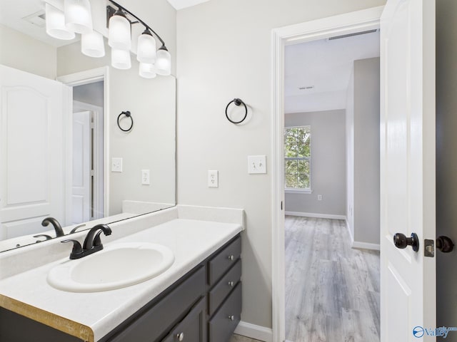 202 Declaration Cir, Madison, AL 35758 - bathroom featuring vanity and wood finished floors