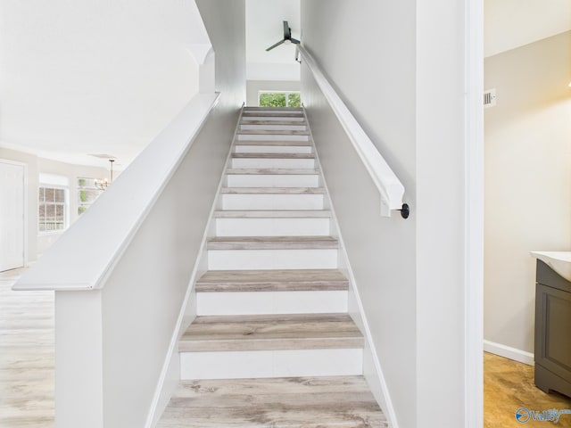 202 Declaration Cir, Madison, AL 35758 - stairs featuring healthy amount of natural light, a chandelier, and wood finished floors