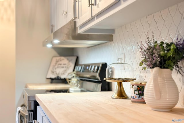 kitchen featuring stainless steel range with electric cooktop and light countertops