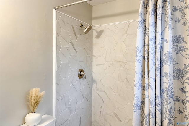 bathroom with a shower with shower curtain