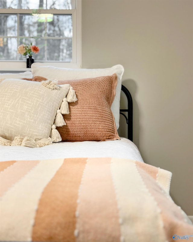 bedroom featuring multiple windows