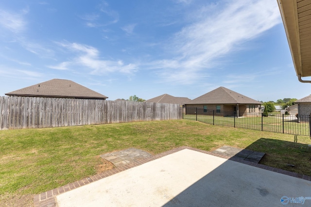 view of yard with a patio area and a fenced backyard