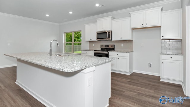 kitchen with sink, a center island with sink, white cabinets, and appliances with stainless steel finishes