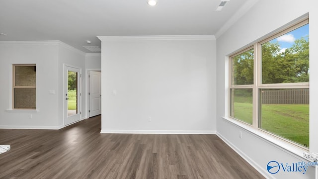 unfurnished room featuring ornamental molding and dark wood-type flooring