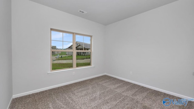 empty room featuring carpet floors