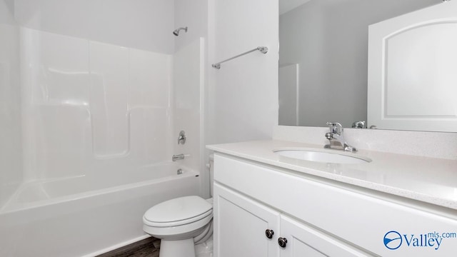 full bathroom with vanity, bathtub / shower combination, and toilet