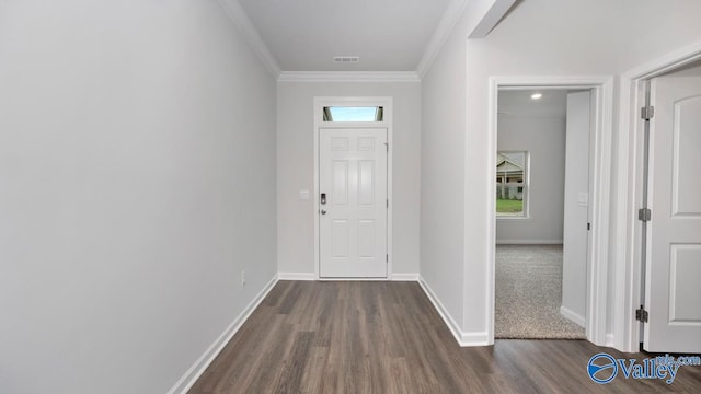 foyer entrance with dark hardwood / wood-style flooring and crown molding