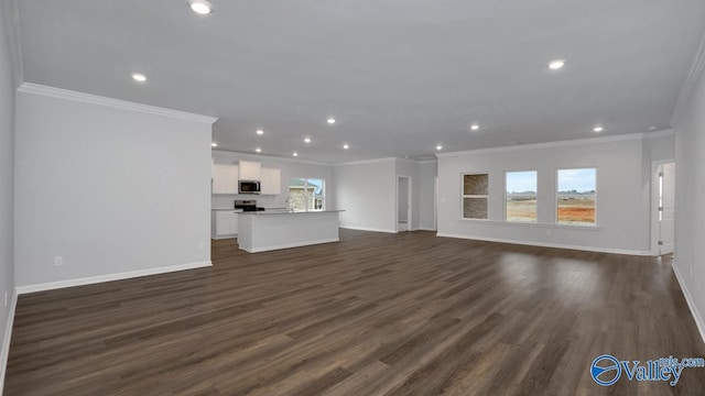 unfurnished living room with crown molding and dark hardwood / wood-style floors